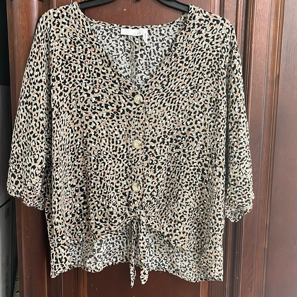 LUQ Cheetah front tie shirt.